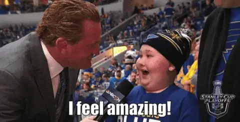 Screenshot of a young hockey fan in a beanie being interviewed, with caption I feel amazing!